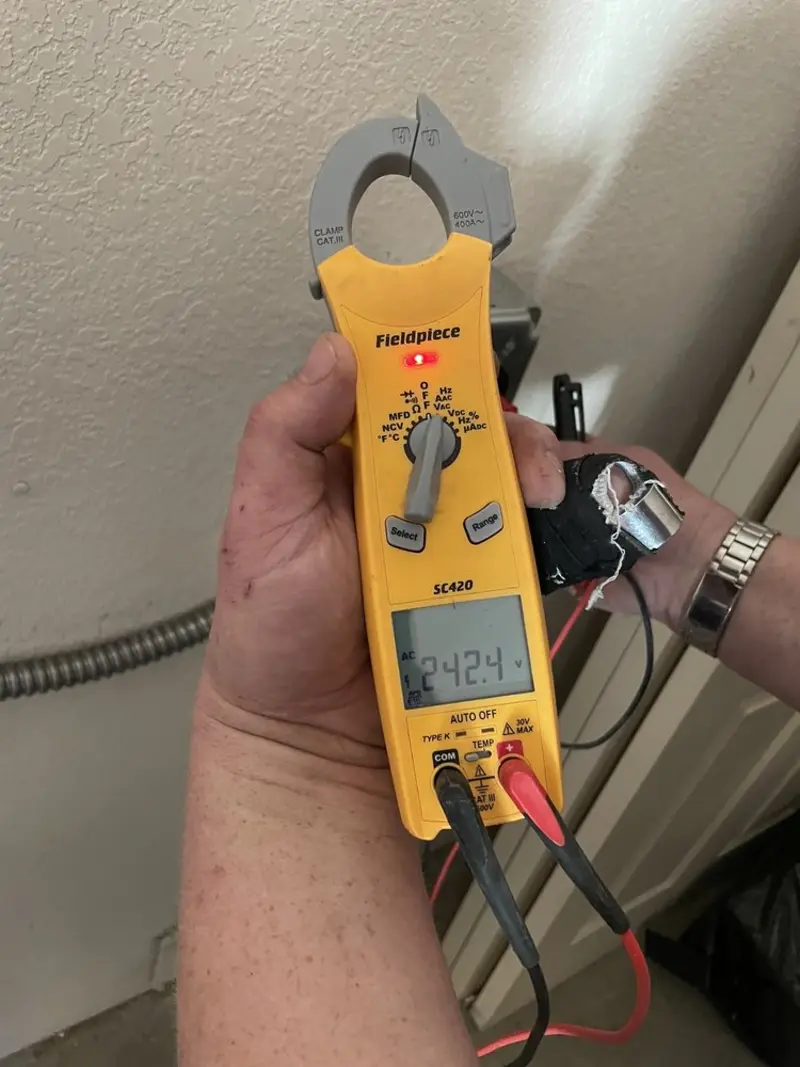 Voltage testing with clamp meter during Generator Installation in Northdale